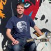 Navy blue t-shirt featuring the x-ray of a skull with a Vespa engine instead of the brain