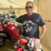 Scooterboy sitting on a red Lambretta chopper wearing a black scooter chopper t-shirt