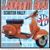 The official patch for the Ladram Bay scooter rally in 2023 featuring a blue background and an orange Vespa scooter.