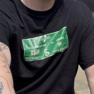 Close-up of green t-shirt design featuring fuels used for Innocenti Lambretta scooters.
